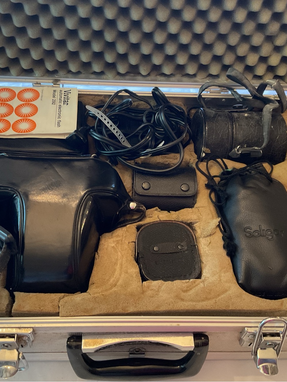Nikon Black Camera Case with Black Leather Accessories and Cables